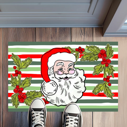 Christmas-themed doormat with Santa Claus design on a wooden floor.