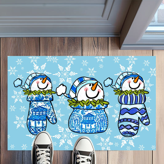 Decorative doormat with snowmen design on a wooden floor