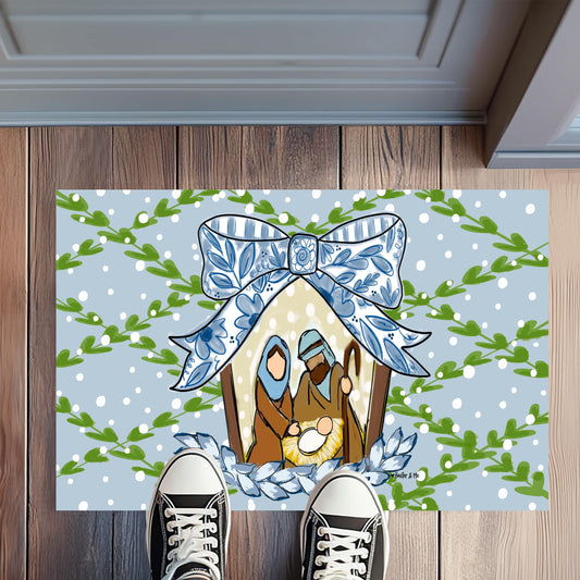 Decorative doormat with a house design on a wooden floor