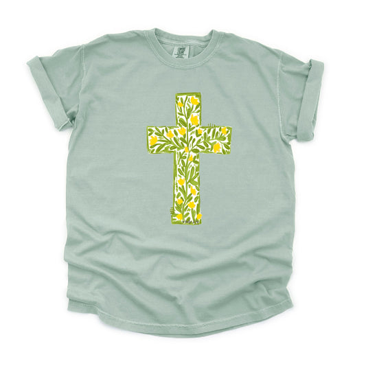 Light green t-shirt with a floral cross design on a white background